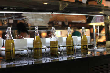 Bottles with different types of olive oil