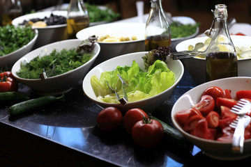 Plates with greens and vegetables