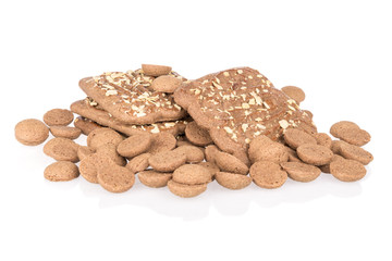 Heap of ginger nuts with speculaas isolated over white