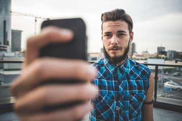 young handsome bearded hipster man selfie