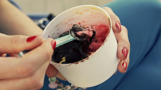 Close Up Of Woman Hands Eating Ice Cream With Spoon