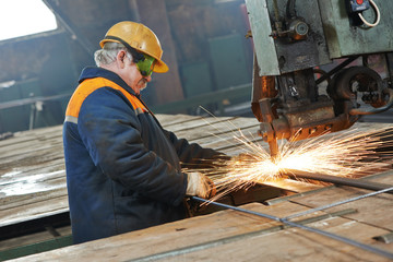 industry worker at spot welding machine