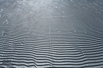 gray texture waves sea sand beach