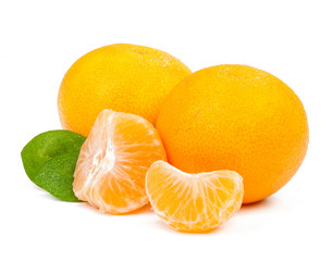 two tangerines and a few slices with leaves isolated