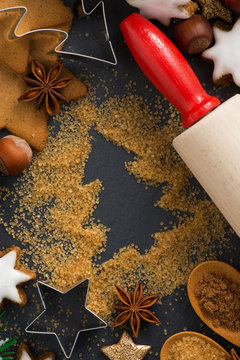 Christmas baking - ingredients and cookies, close-up, top view