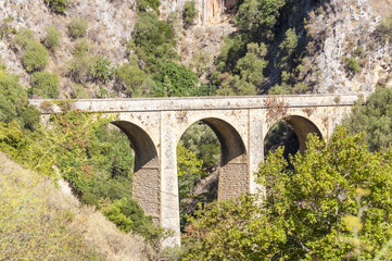 Fototapeta na wymiar Arch bridge on the old road to Rethymno, Crete
