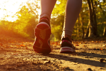 Girl running at sunset