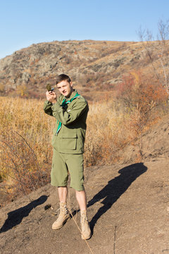 Scout Leader Taking A Compass Sighting