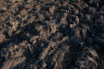 background made of dark plowed soil