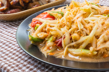 Closeup Thai papaya salad serve with vegetables, popular thai