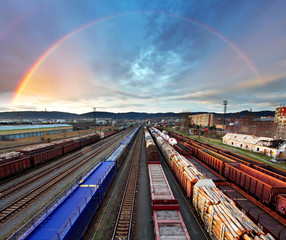 Plakat Train Freight transportation with rainbow - Cargo transit