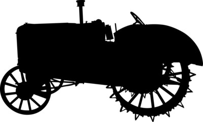 Vector silhouette of old tractor of road