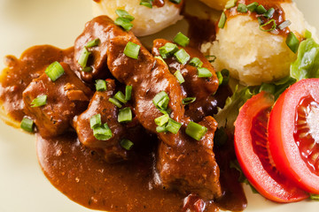 Goulash with boiled potatoes