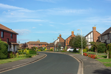 Fototapeta na wymiar Houses and road in suburbia