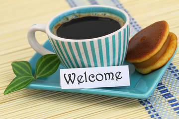 Welcome card with cup of coffee and cookie