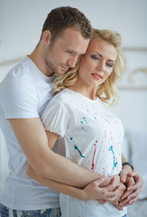 couple standing embracing