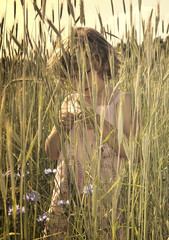 Young girl in a field of grain.