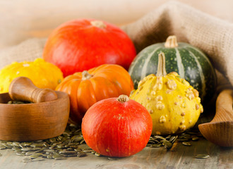 Mixed Pumpkins  on a wooden background.