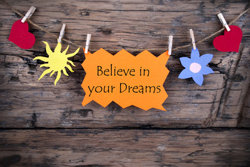 Orange Lable Saying Believe In Your Dreams