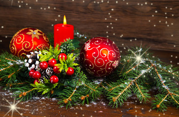 Red Christmas decorations on spruce branches