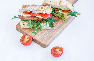 Sandwiches with ccarpaccio, cheese and cherry-tomatoes