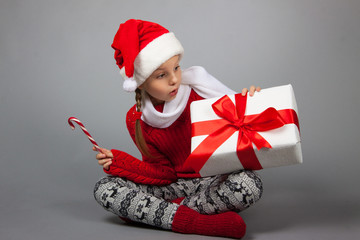 Surprised girl with Christmas present