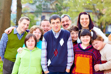 group of happy people with disabilities - 72896592