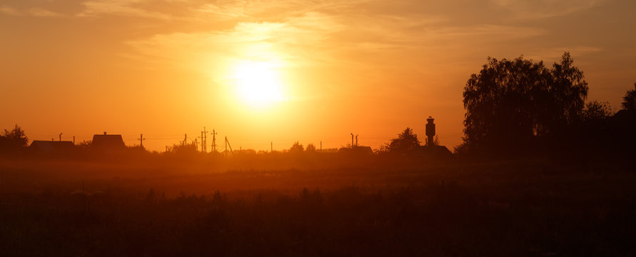 Fototapeta Orange sunset in the countryside