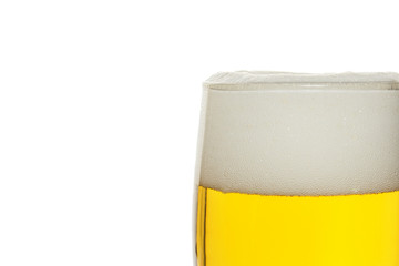 Beer into glass isolated on white
