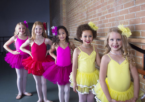 Cute young ballerinas at a dance studio (diverse group of girls)