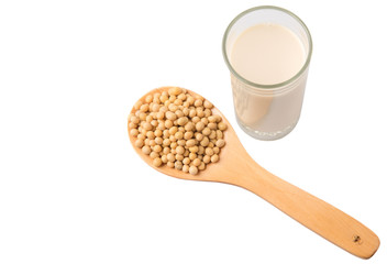 Soybean in a white bowl and a glass of soybean milk over white 