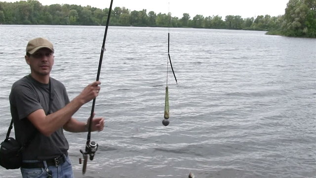 man  fisherman hooked fish