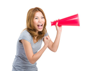 Thrilled woman shout with megaphone
