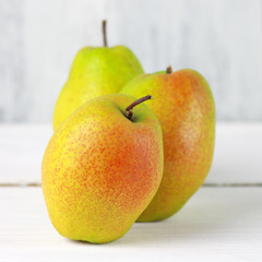 Pears on white wood