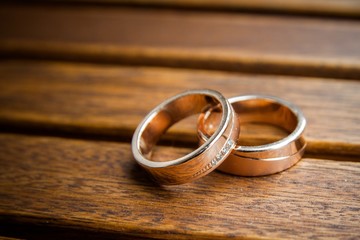 Wedding rings on wooded background - 72905187