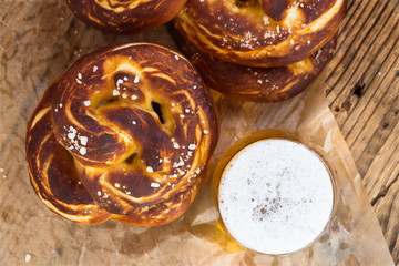 Refreshing beer ready to drink and fresh bavarian pretzels