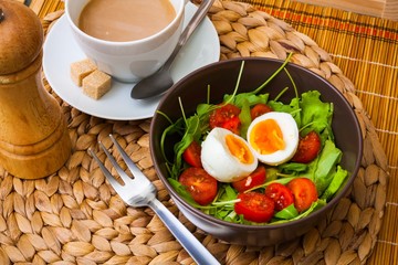 Ruccola salad with tomatoes, egg, coffee