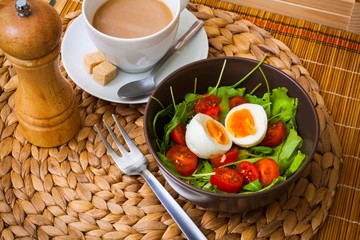 Ruccola salad with tomatoes, egg, coffee