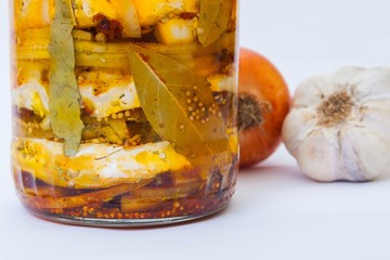 Spicy marinated cheese on white background