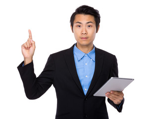 Businessman use tablet and finger point up