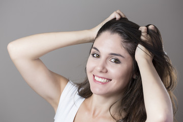 Fototapeta premium Portrait of a young brunette woman making faces with different e