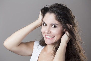 Naklejka premium Portrait of a young brunette woman making faces with different e