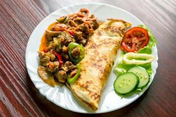 Delicious food on white plate