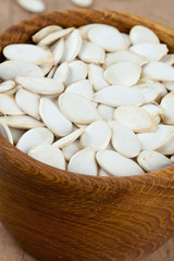 pumpkin seeds on wooden surface