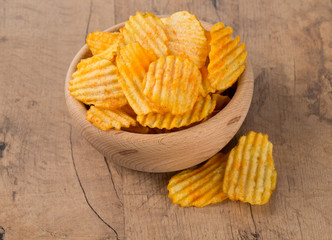 potato chips in a wooden bowl