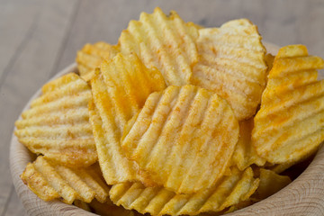 potato chips in a wooden bowl