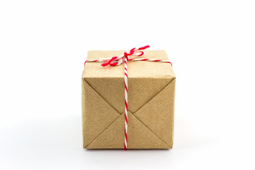 Cardboard carton wrapped with brown paper.