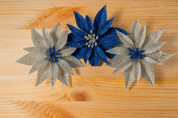 Christmas decorations flowers on a wooden background