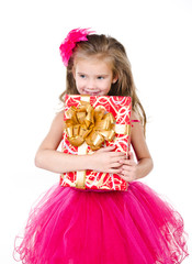 Happy adorable little girl with christmas gift box