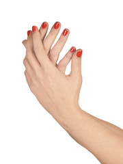 Manos de mujer con las uñas pintadas de color rojo sobre fondo blanco aislado. Vista de frente